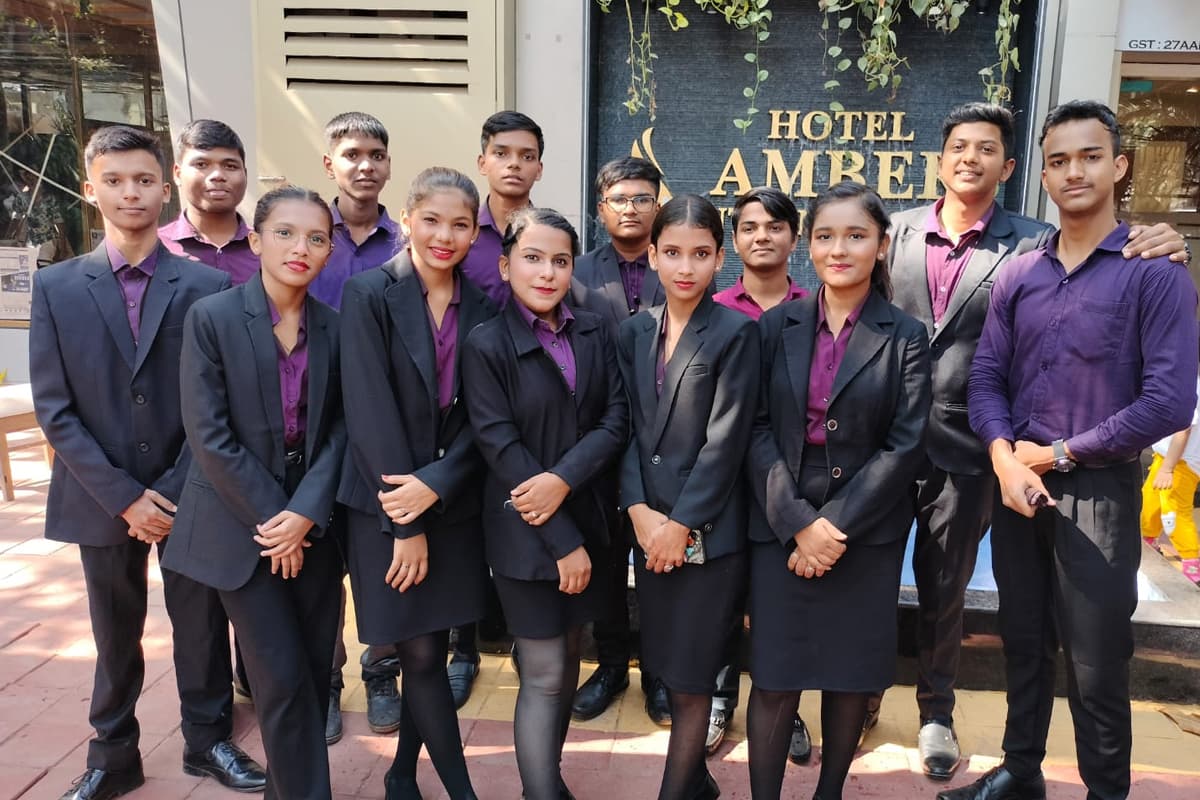 Centuria students in uniform outside a hotel during an industry visit